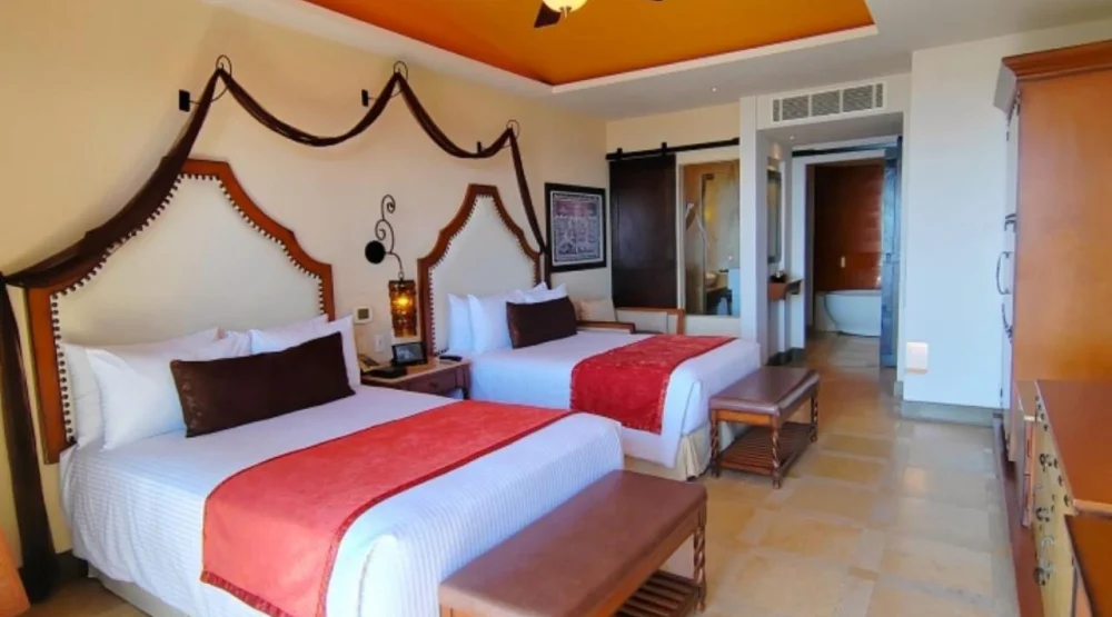 Swimout Junior Suite Ocean View with Two Double Beds at Secrets Puerto Los Cabos Golf & Spa Resort